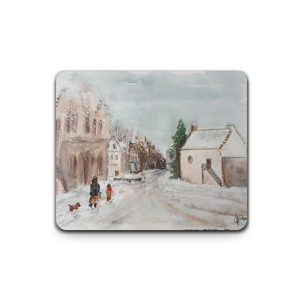 Placemat with a winter scene of a village street and people walking.